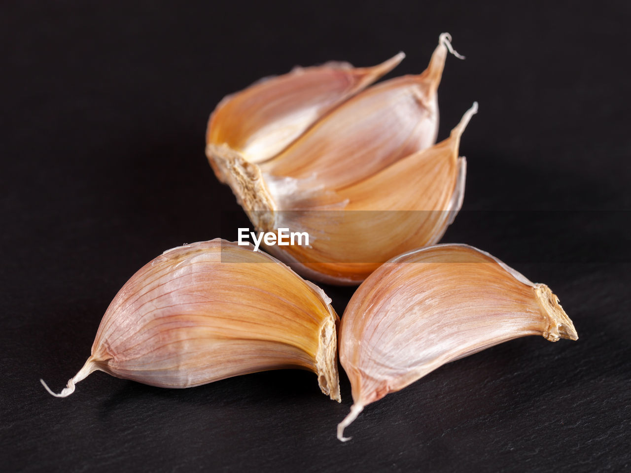 food, food and drink, garlic, black background, ingredient, studio shot, produce, spice, wellbeing, indoors, freshness, healthy eating, plant, still life, no people, close-up, shallot, vegetable, garlic clove, garlic bulb, flower, petal, organic