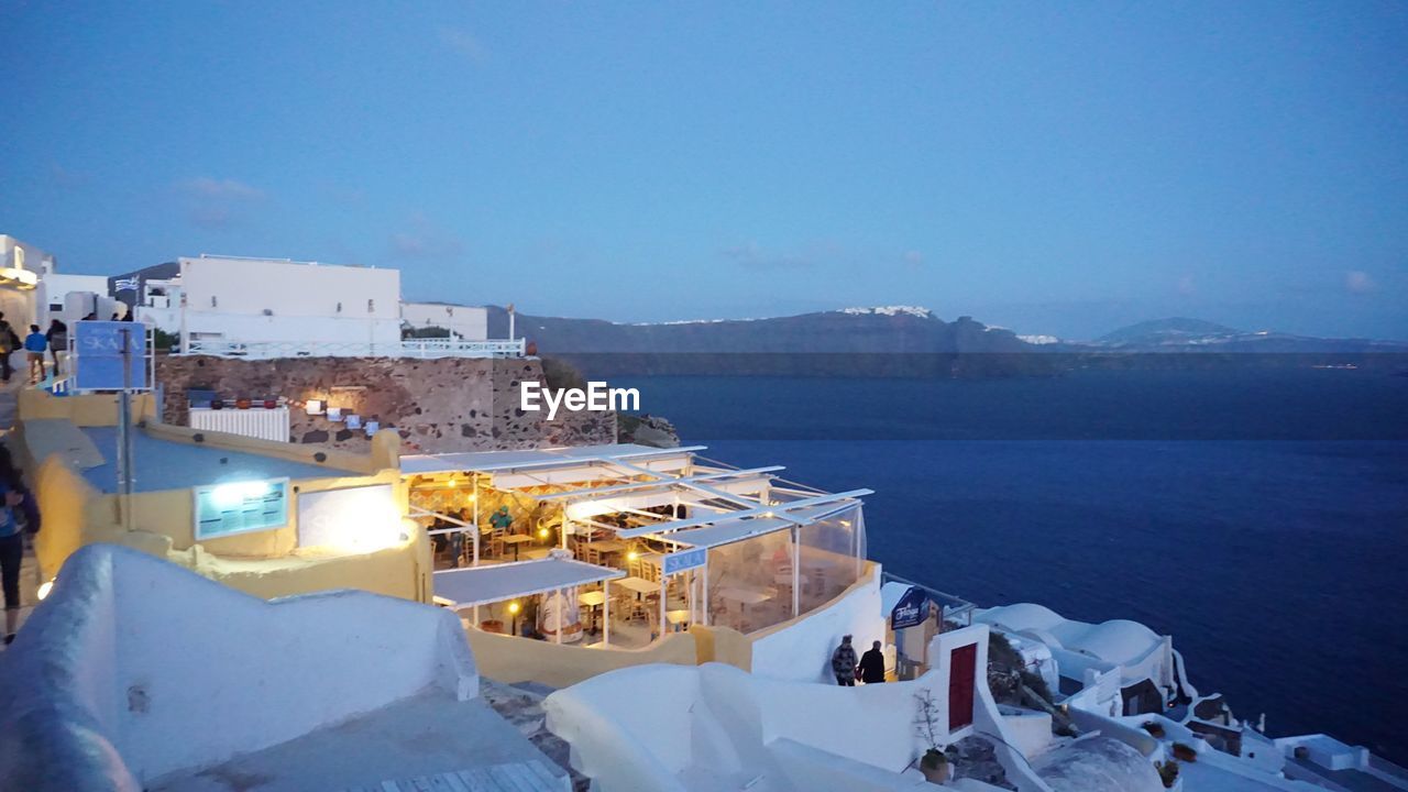 High angle view of oia castle by sea against sky