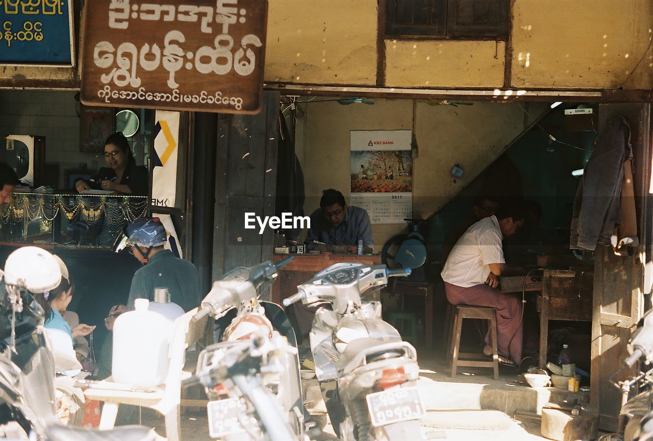 GROUP OF PEOPLE AT MARKET