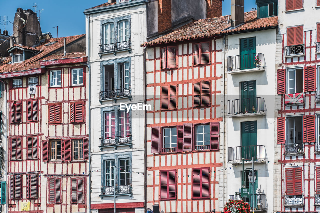 LOW ANGLE VIEW OF RESIDENTIAL BUILDINGS