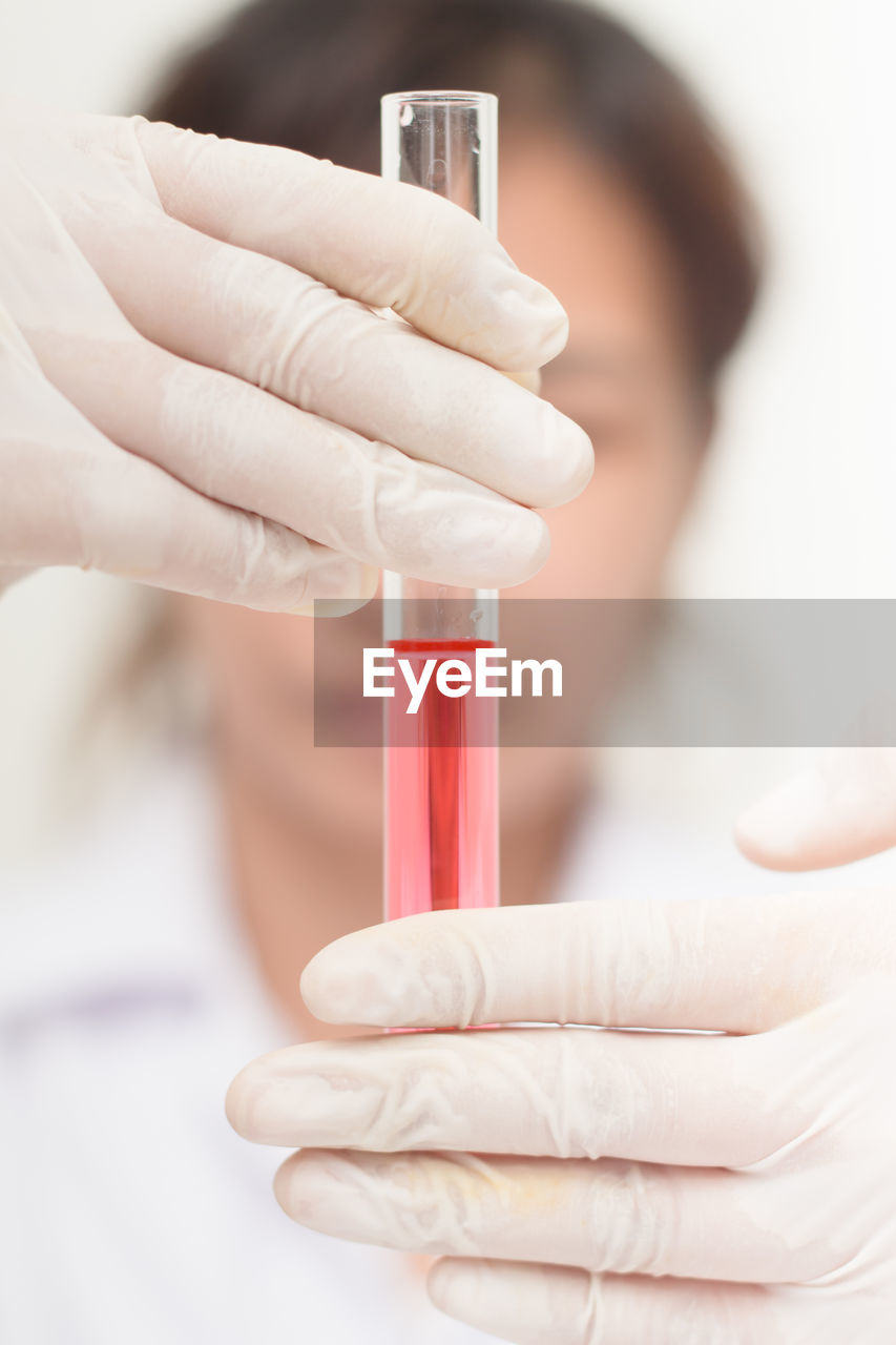 Close-up of pipette with pink liquid