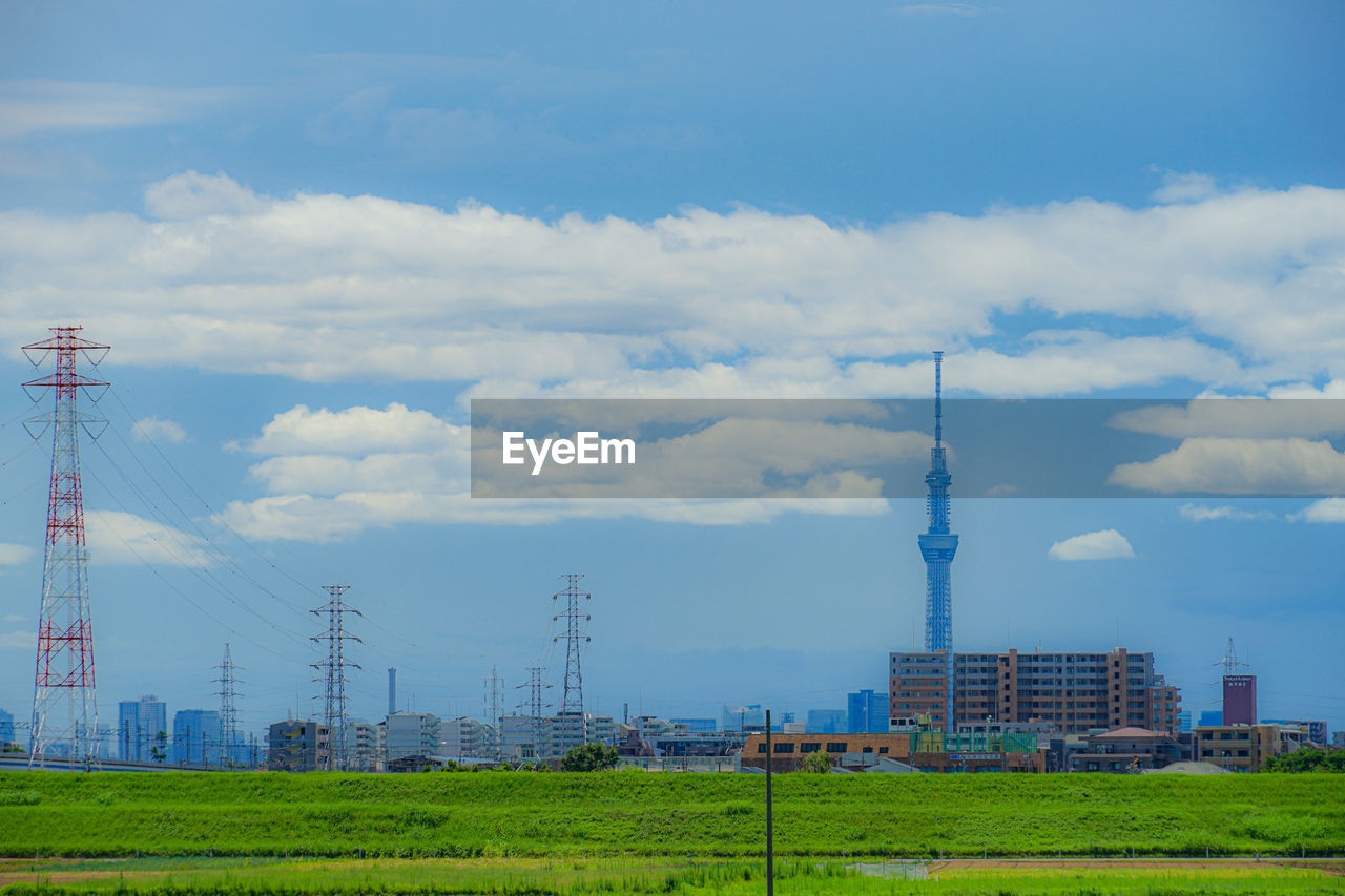 low angle view of electricity pylons against sky