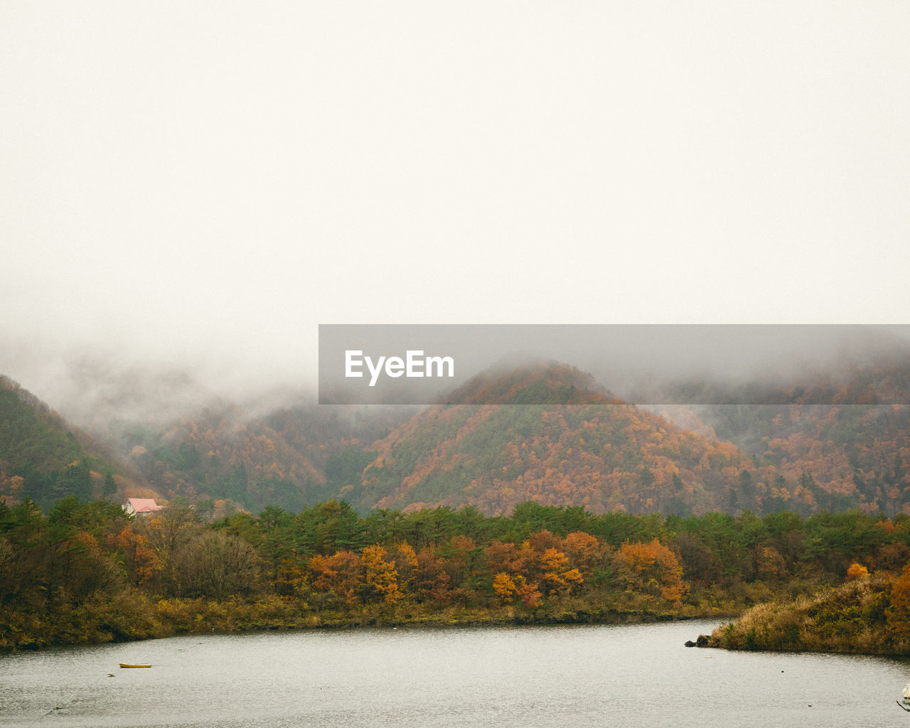 Scenic view of lake against sky during autumn