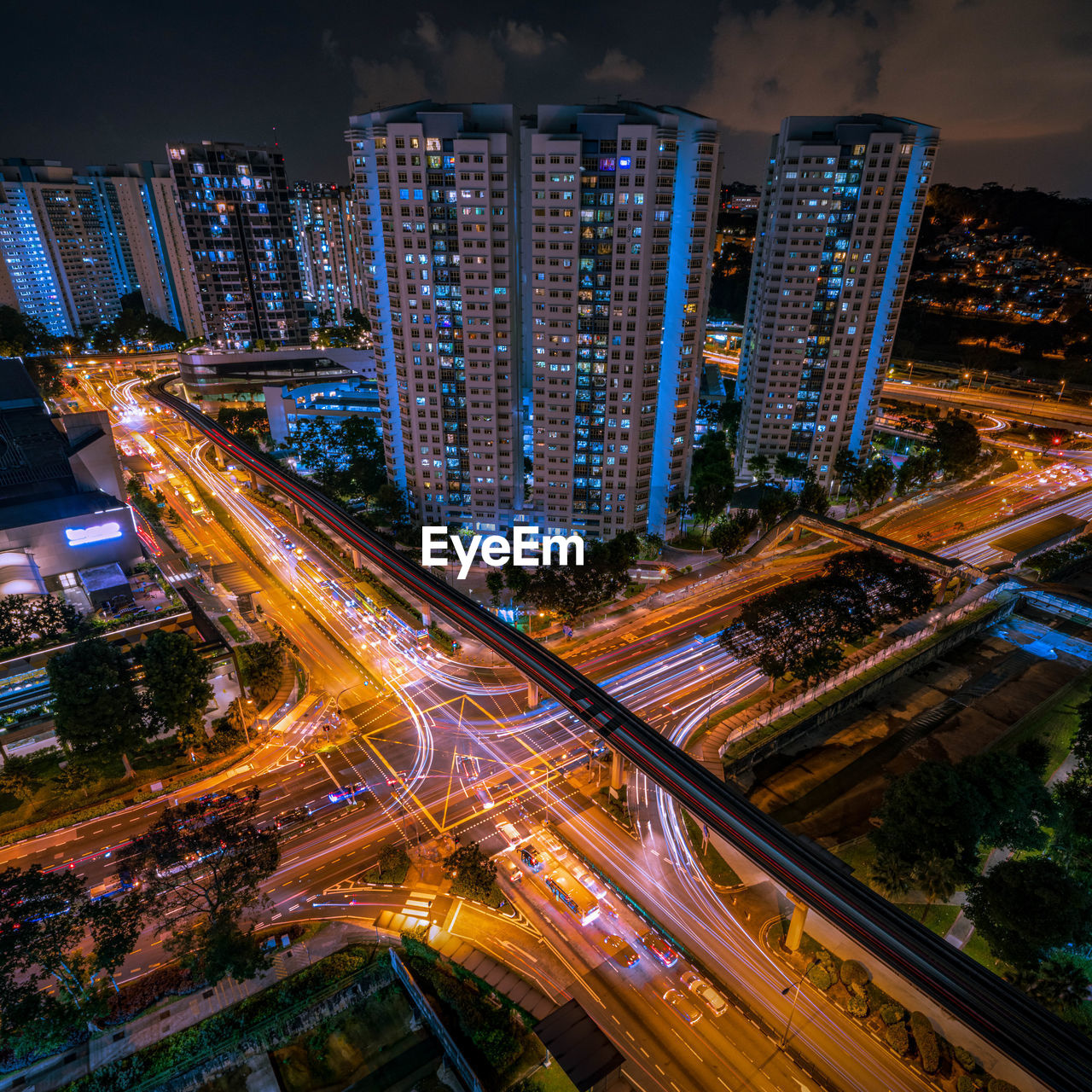 High angle view of illuminated city street and buildings at night