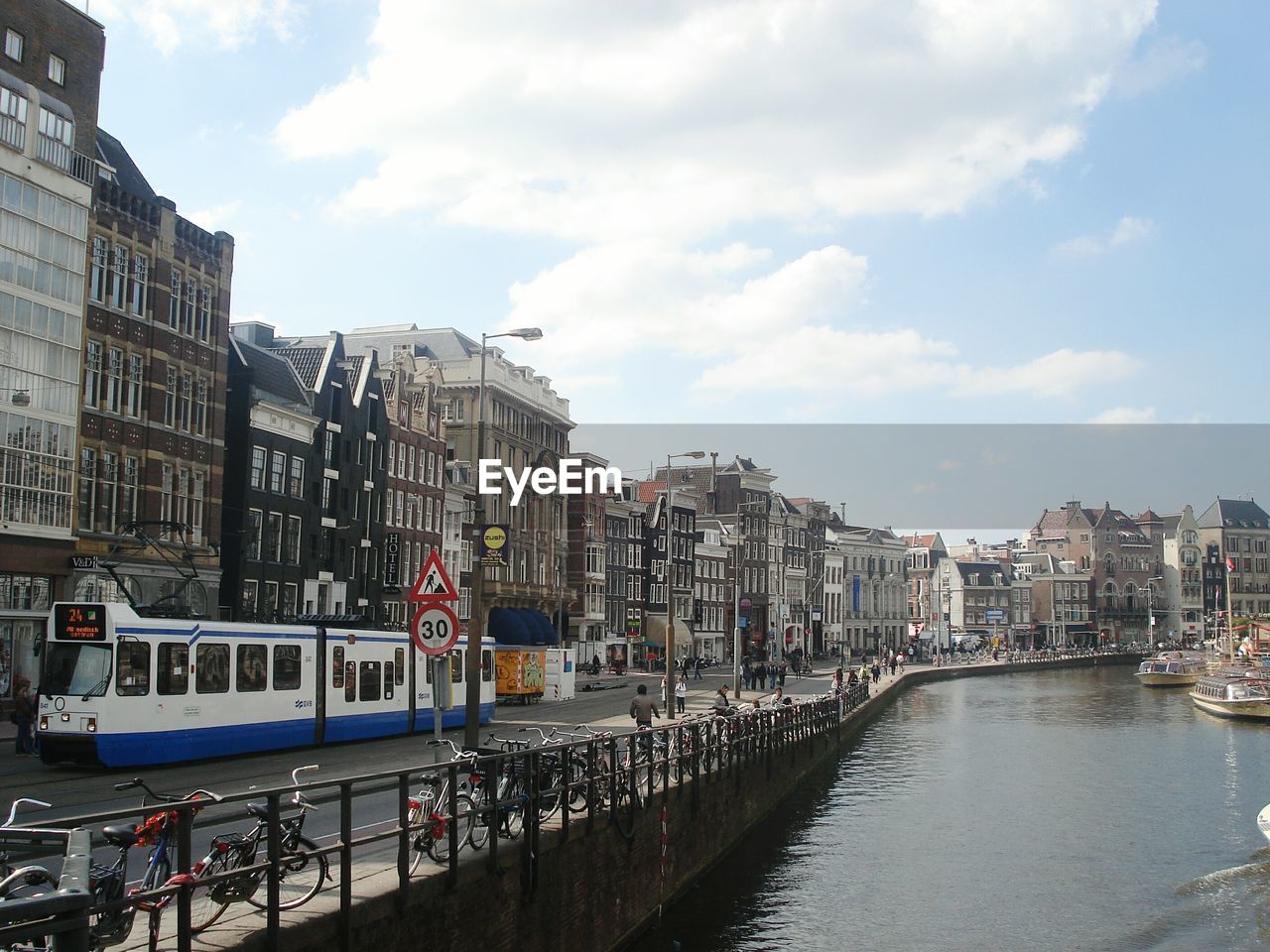 Boats in river with buildings in background