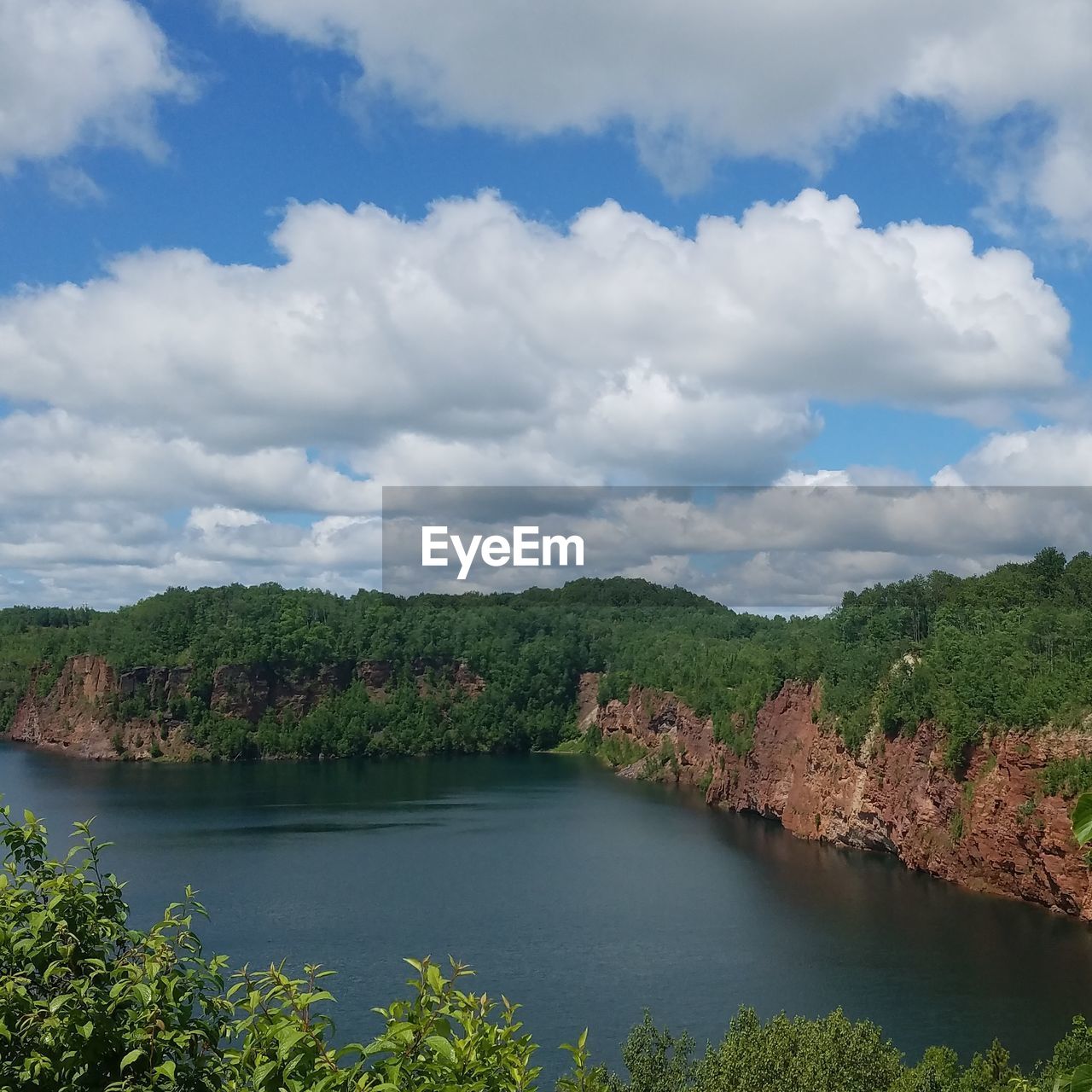 SCENIC VIEW OF RIVER AND LANDSCAPE AGAINST SKY