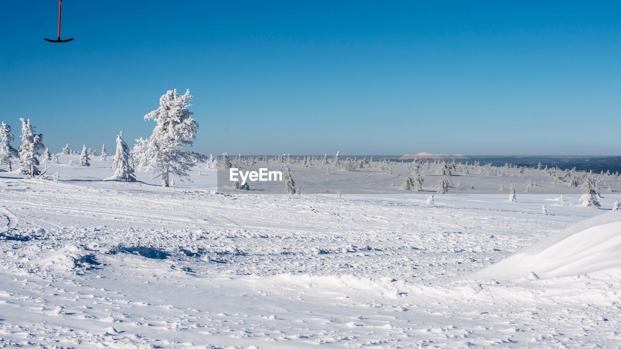 LOW ANGLE VIEW OF SNOW AGAINST SKY