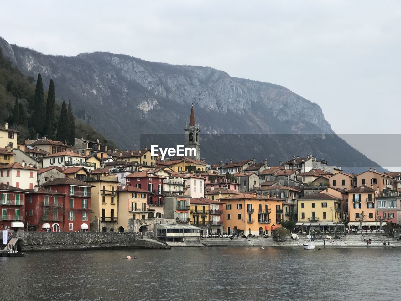 Townscape of varenna by sea against sky at lake como 
