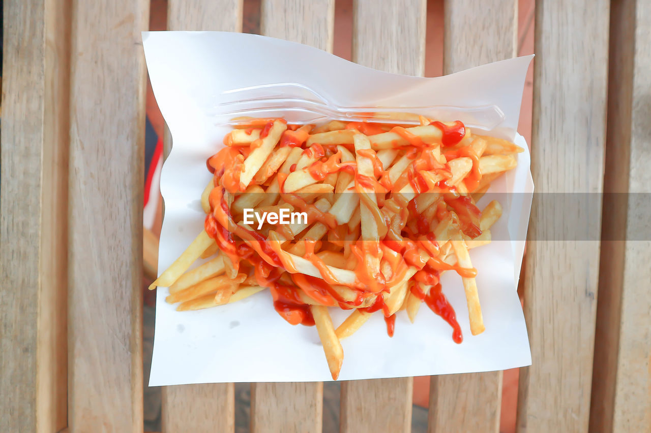 food and drink, food, fast food, freshness, wood, produce, high angle view, dish, vegetable, table, no people, healthy eating, penne, directly above, indoors, wellbeing, still life, seafood, plate, cuisine, french fries, close-up