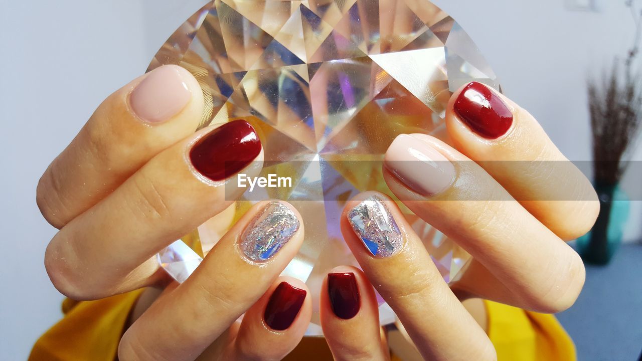 Close-up of woman holding large diamond