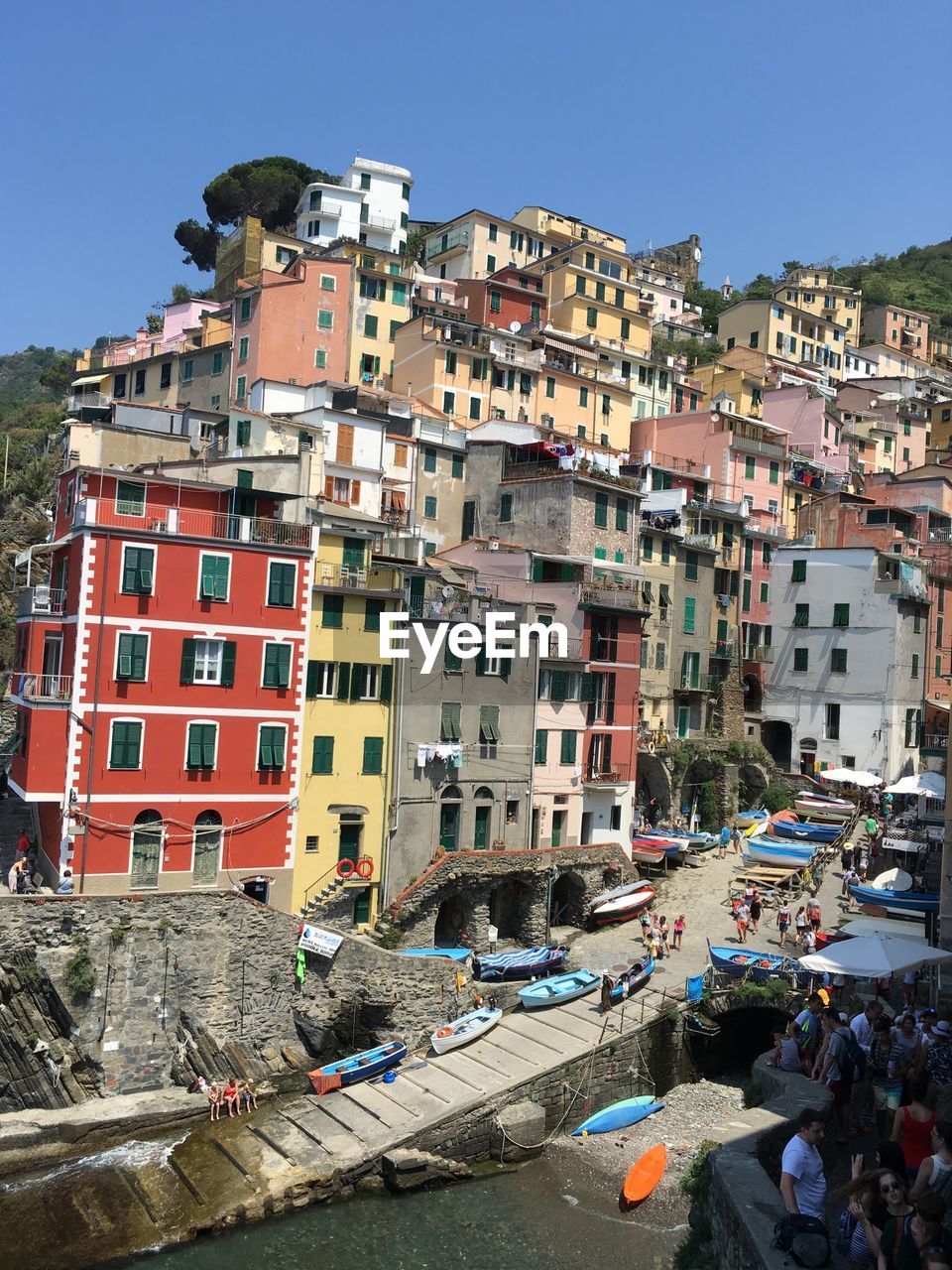 High angle view of buildings in town against clear sky