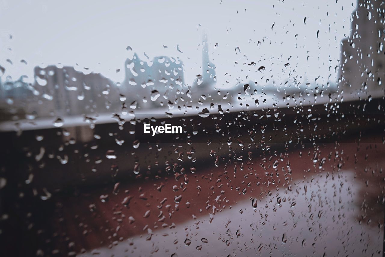 Full frame shot of wet window during rainy season