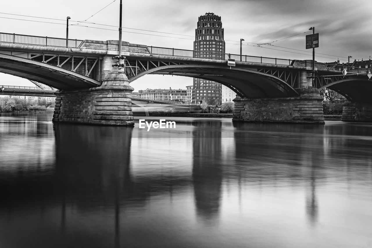 bridge, architecture, built structure, black and white, water, transportation, monochrome, reflection, sky, monochrome photography, city, river, nature, travel destinations, cloud, building exterior, no people, travel, cityscape, outdoors, arch, waterfront, landscape, city life, long exposure