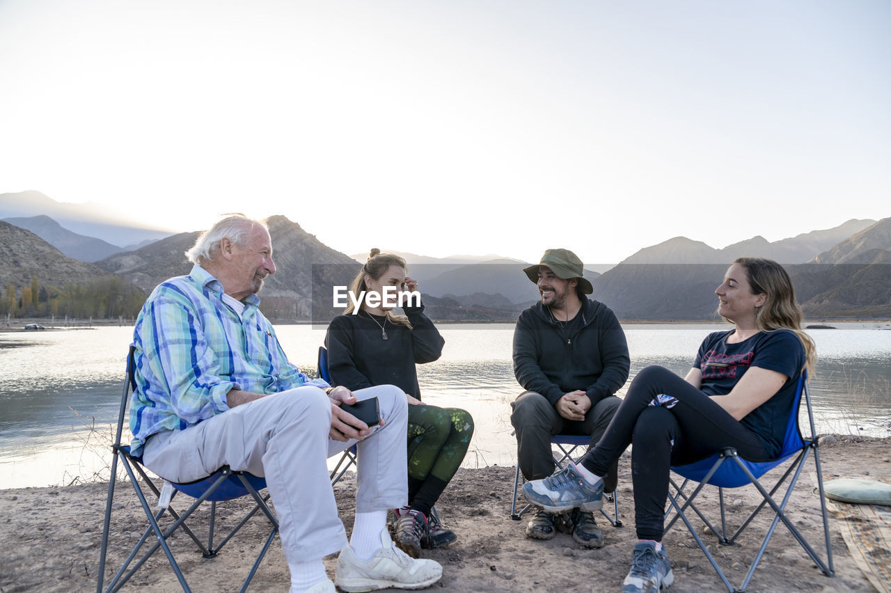 Family enjoying time together while relaxing outdoors in nature.