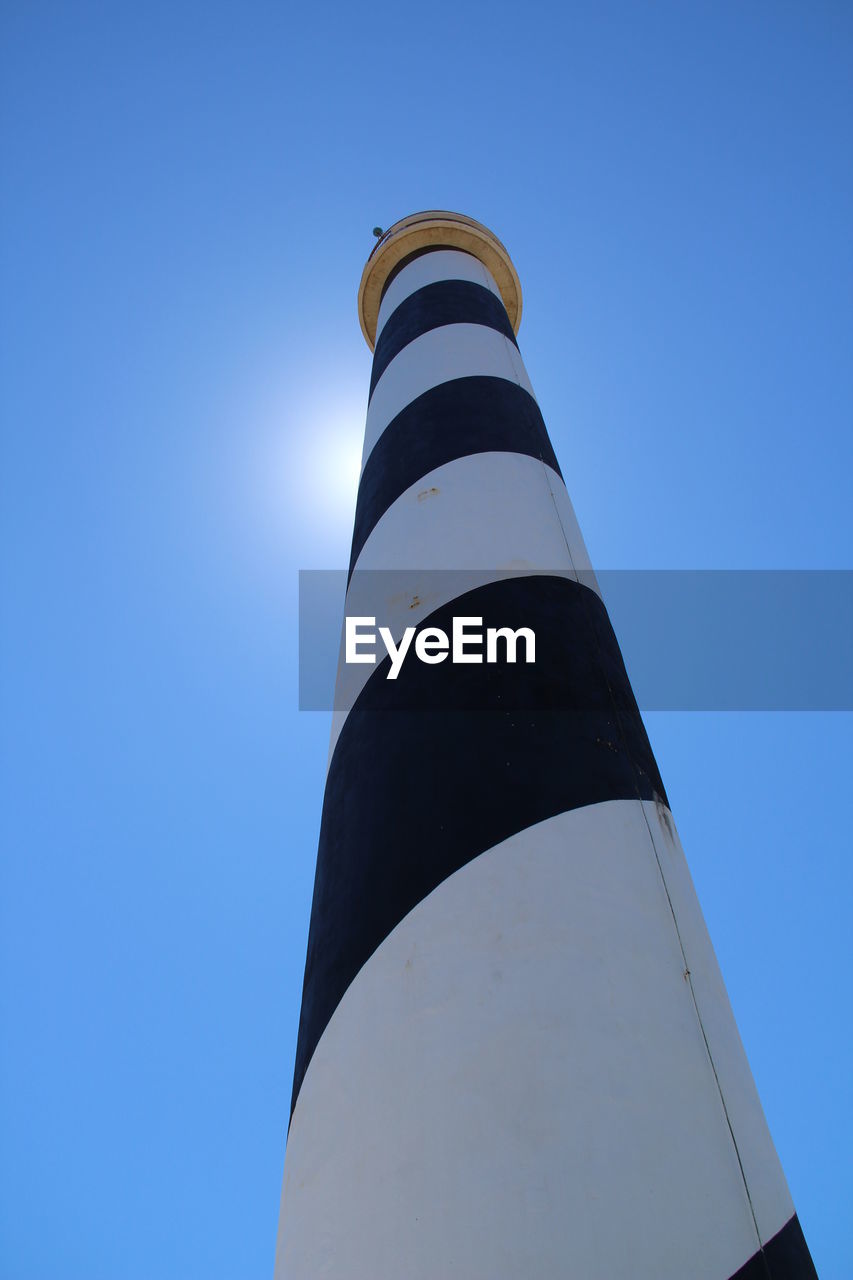 Low angle view of pole against clear blue sky