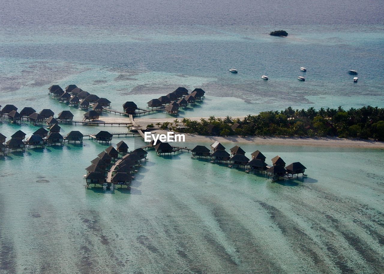 HIGH ANGLE VIEW OF PEOPLE ON RIVERBANK