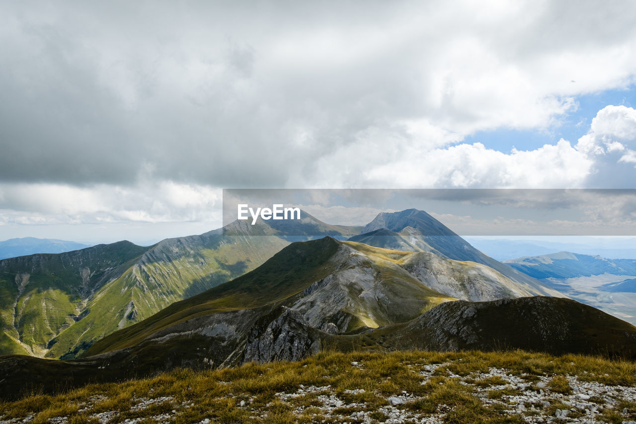 Scenic view of mountains against sky in montemonaco, marche italy