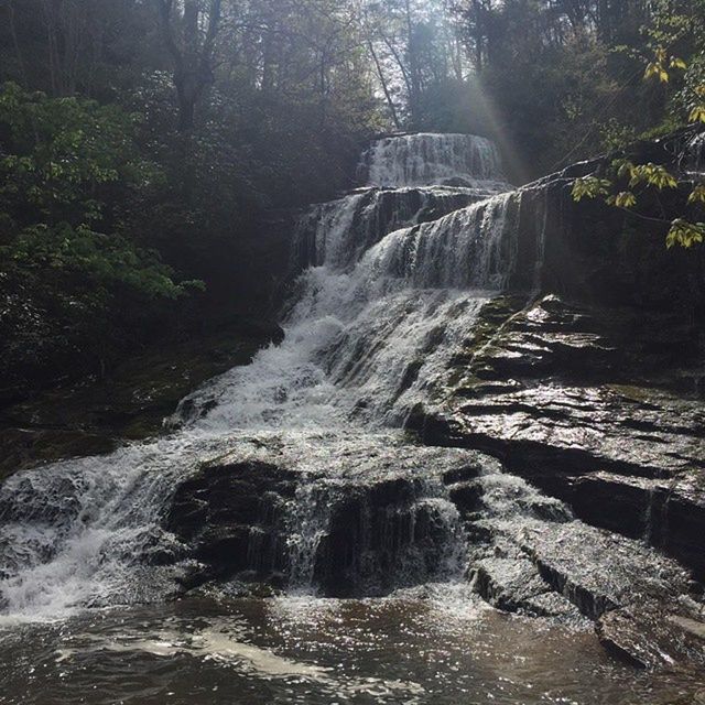 STREAM FLOWING THROUGH ROCKS