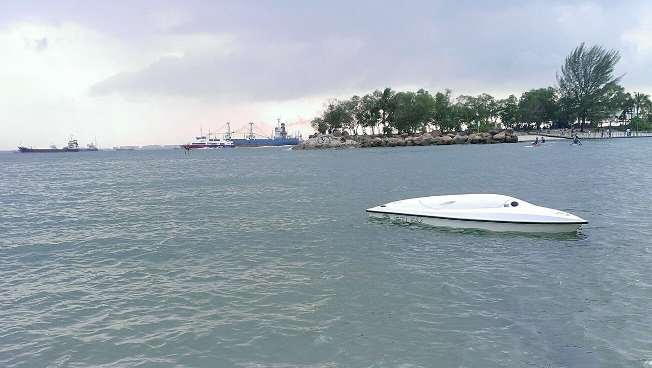 BOATS SAILING IN SEA