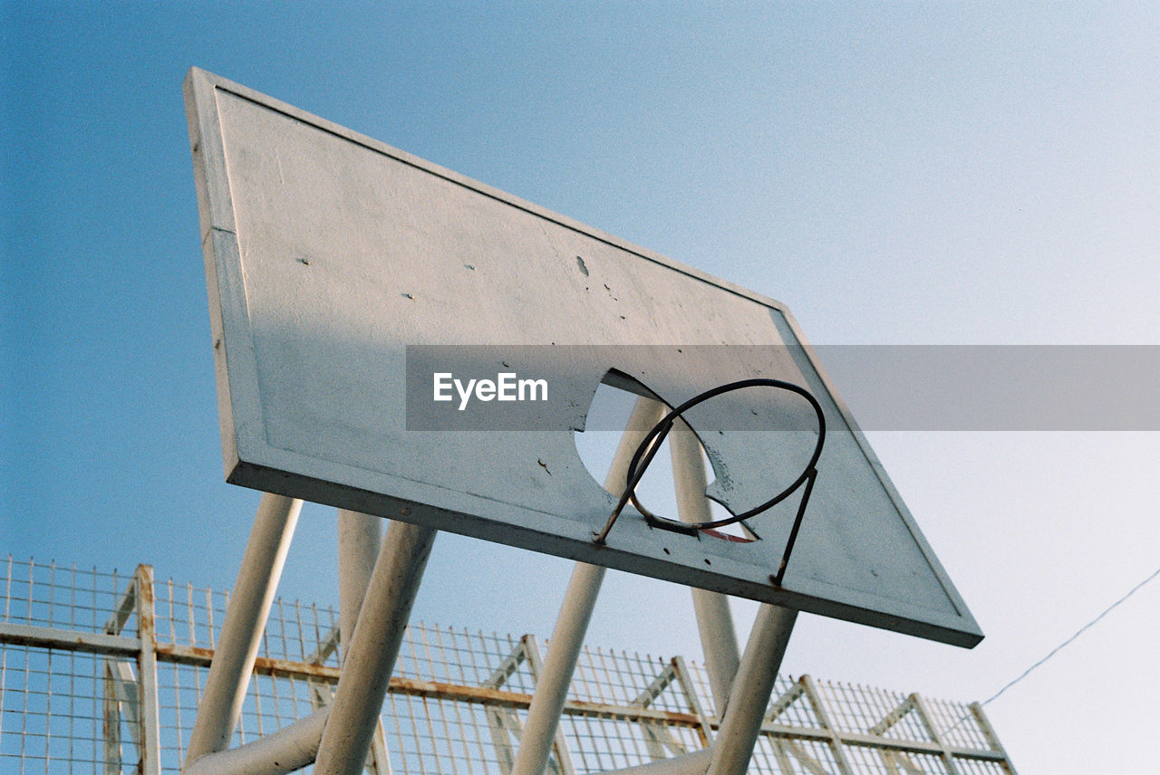 Low angle view of basketball hoop against clear sky