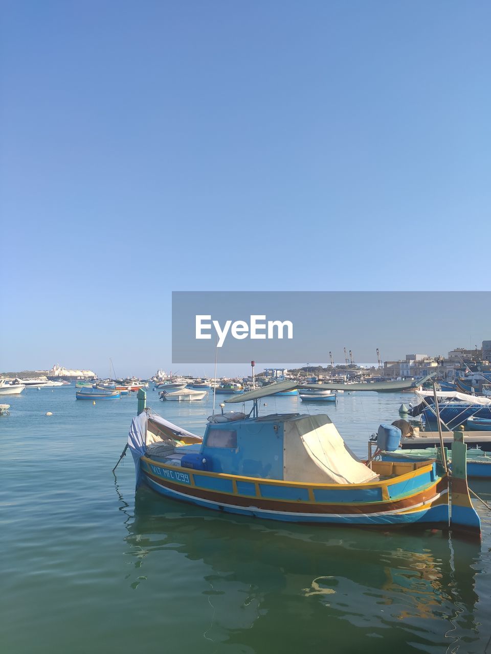 blue, water, nature, nautical vessel, reflection, day, sky, transportation, clear sky, copy space, vehicle, no people, outdoors, sea, mode of transportation, mast, sunlight, architecture, sunny, travel, ship