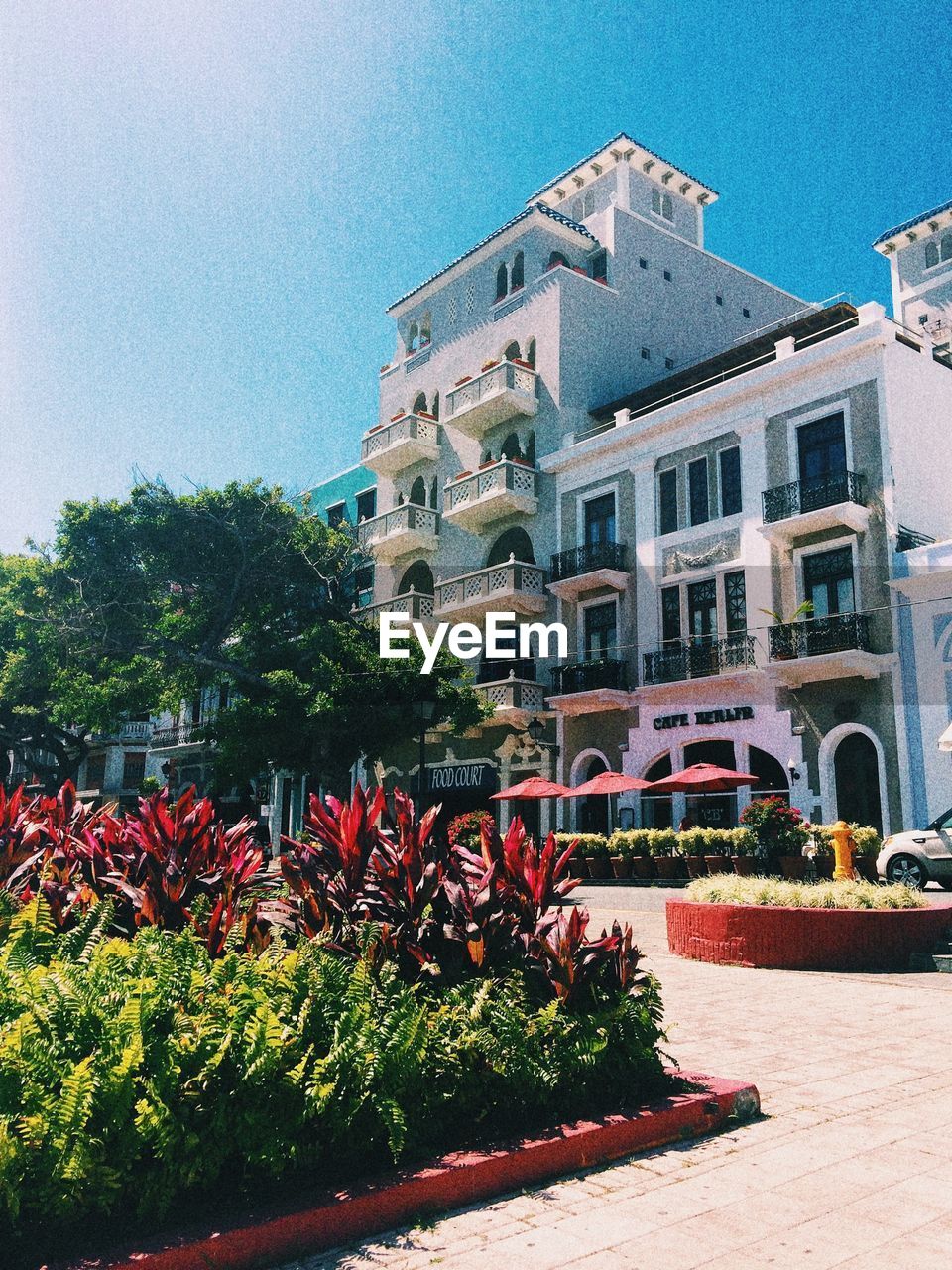 Exterior of hotel against clear blue sky