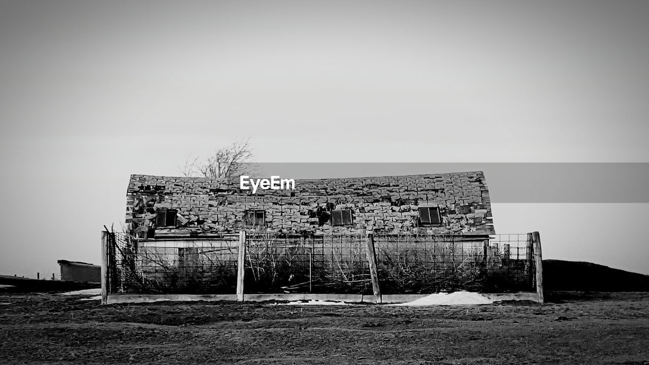 ABANDONED BUILDING AGAINST CLEAR SKY