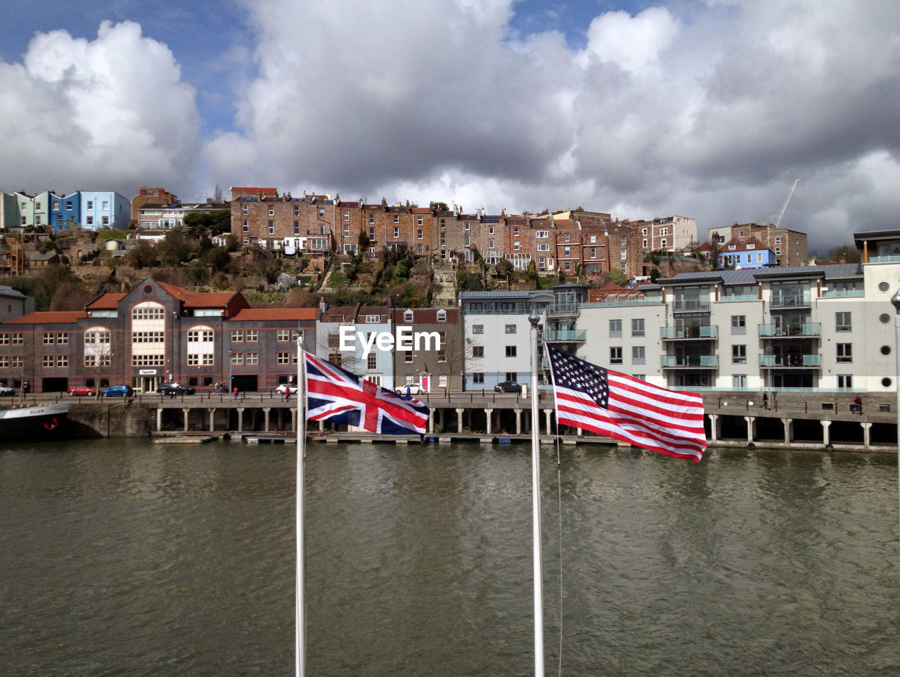 American and british flag against the town