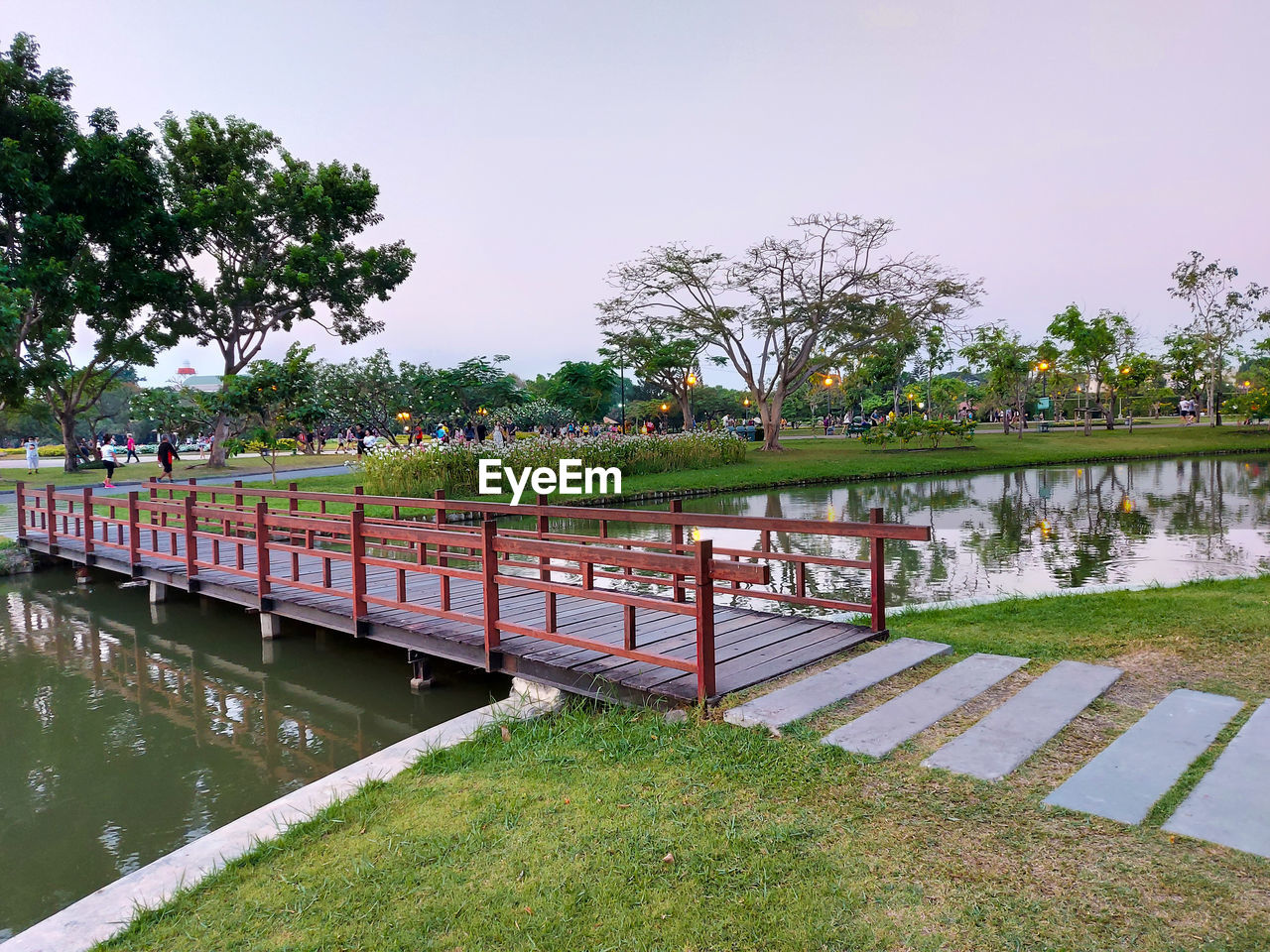 Footbridge over lake in park