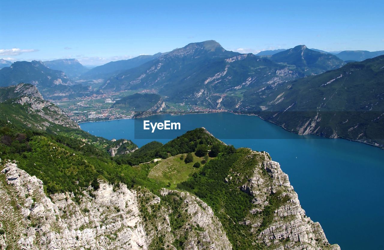 High angle view of lake amidst mountains against sky