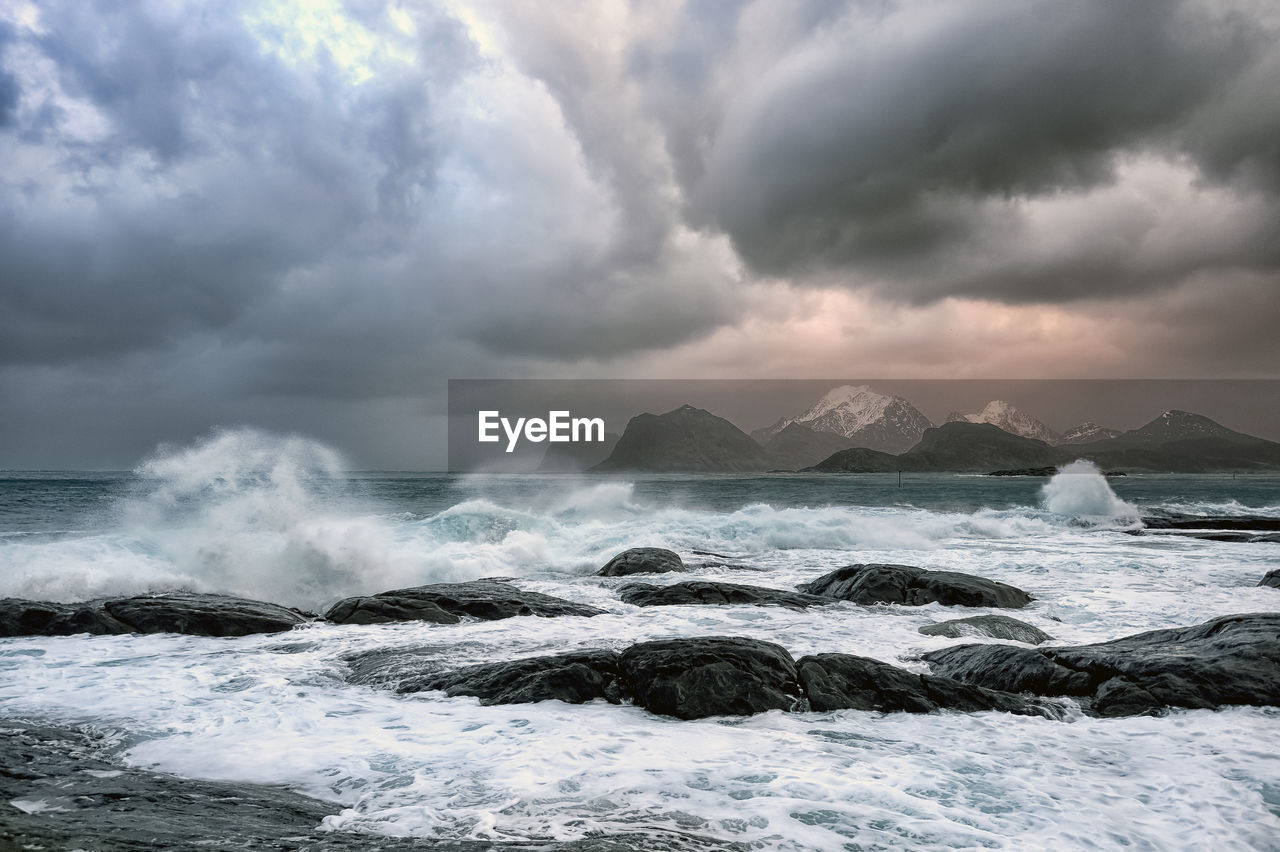 Scenic view of stormy sea against threatning sky