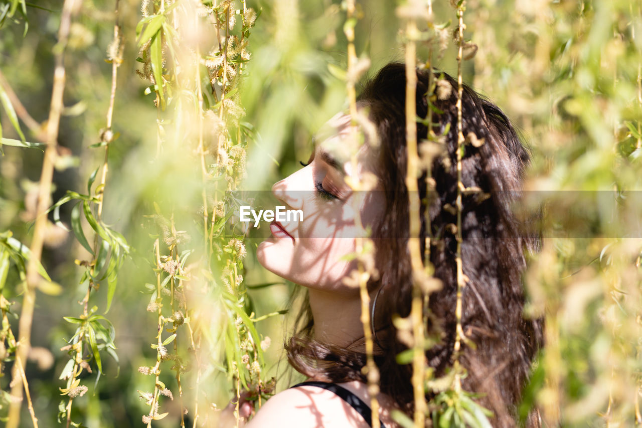 WOMAN LOOKING AWAY ON FIELD