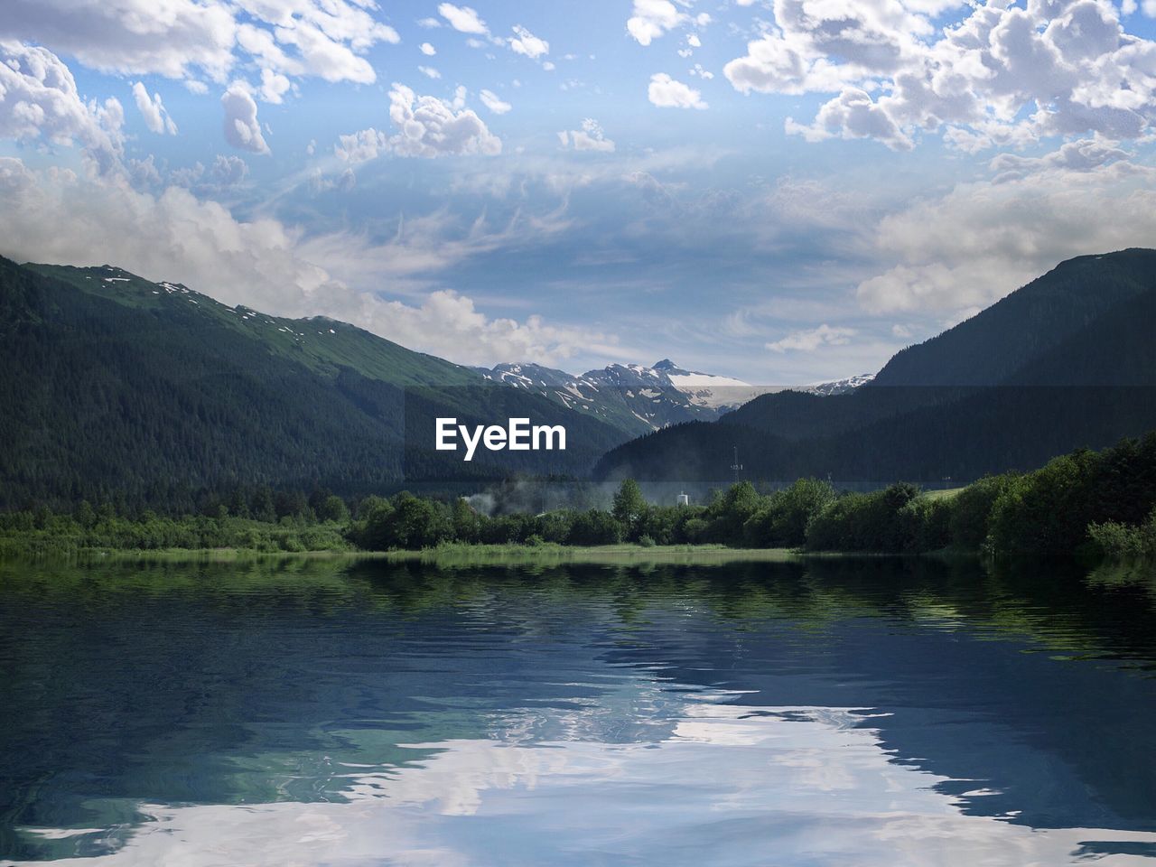 Scenic shot of lake against mountain range