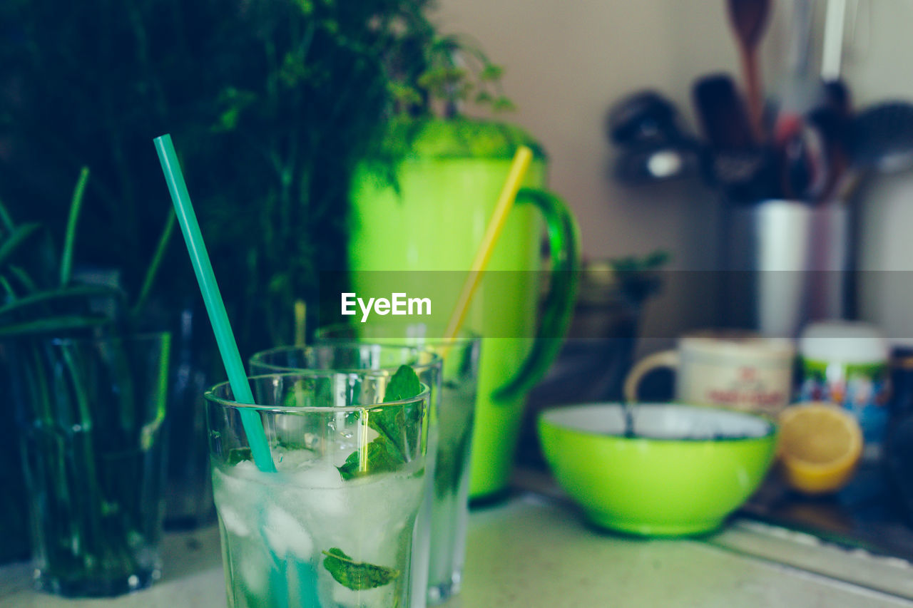 CLOSE-UP OF BEER GLASS ON TABLE