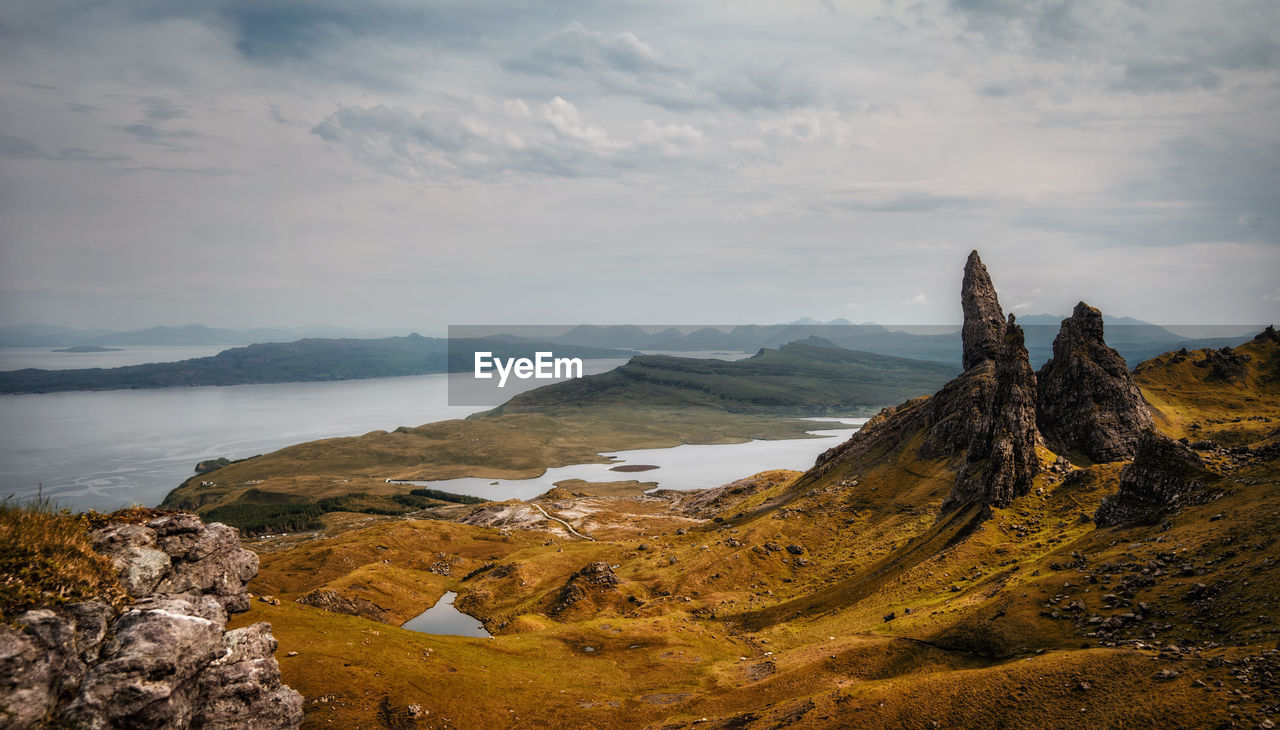 Panoramic view of sea and mountains against sky