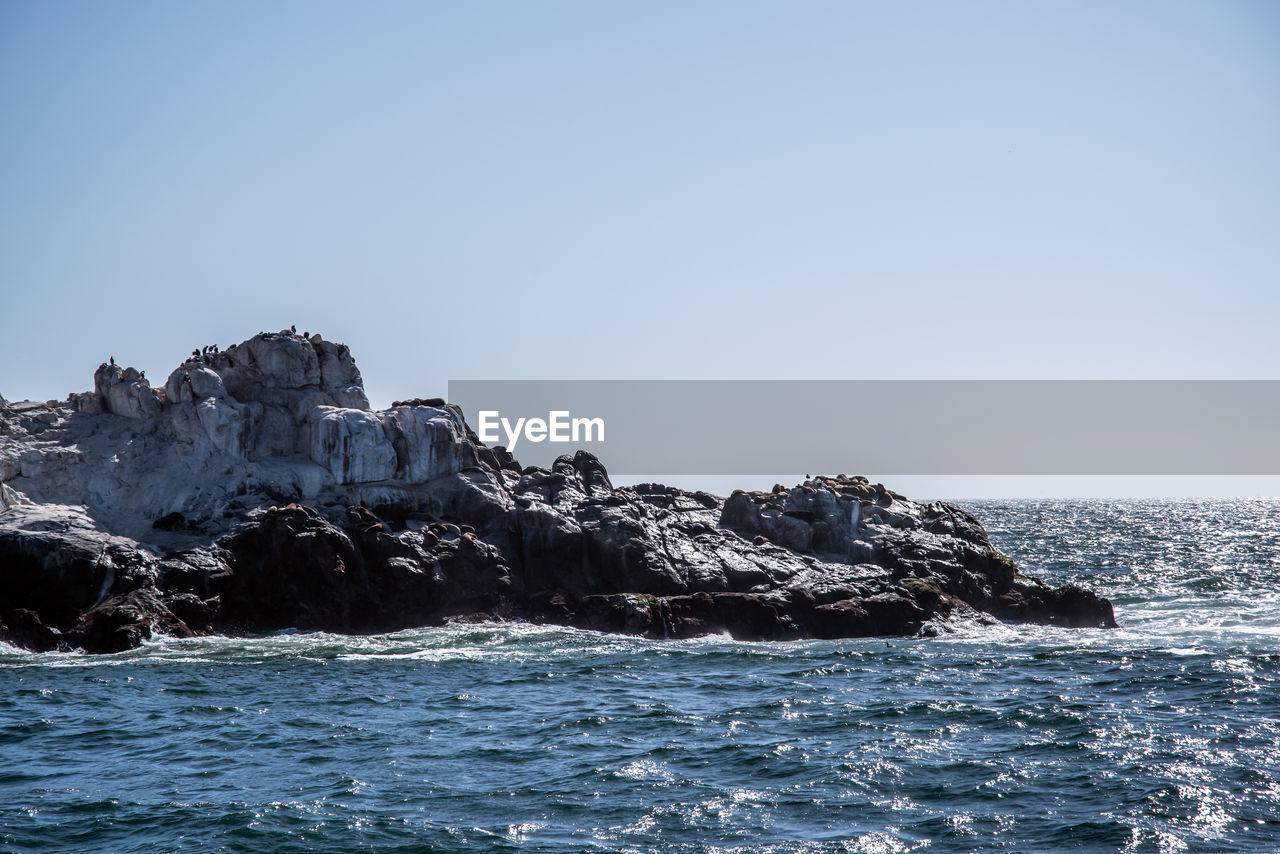 Scenic view of sea against clear sky