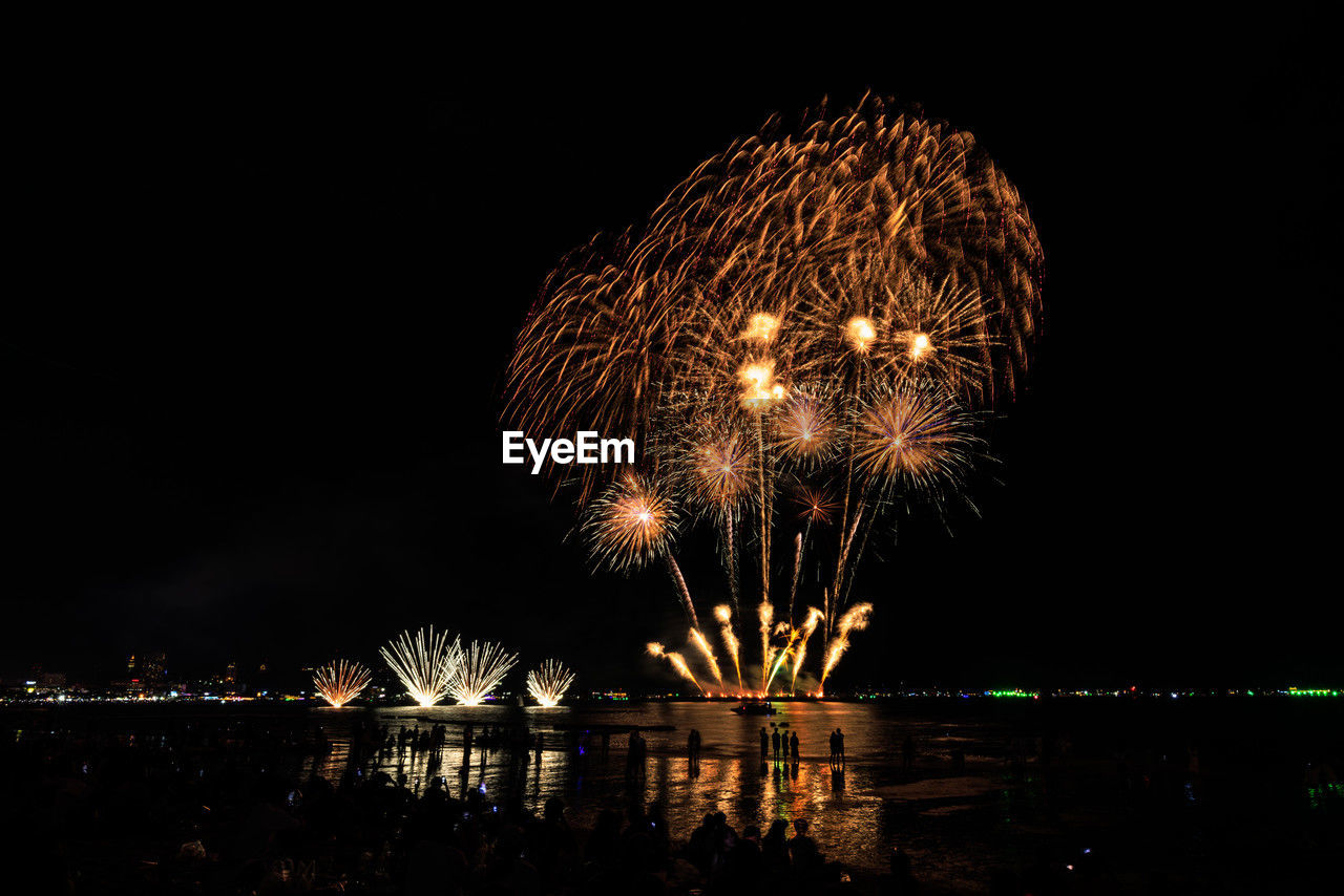 fireworks, night, firework display, illuminated, arts culture and entertainment, celebration, event, motion, exploding, water, recreation, reflection, nature, sky, firework - man made object, no people, architecture, outdoors, glowing, new year's eve, midnight, dark, long exposure, city, river