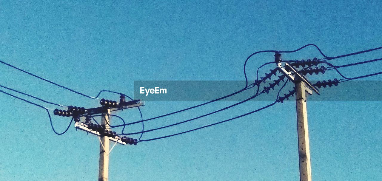 LOW ANGLE VIEW OF TELEPHONE POLE AGAINST SKY