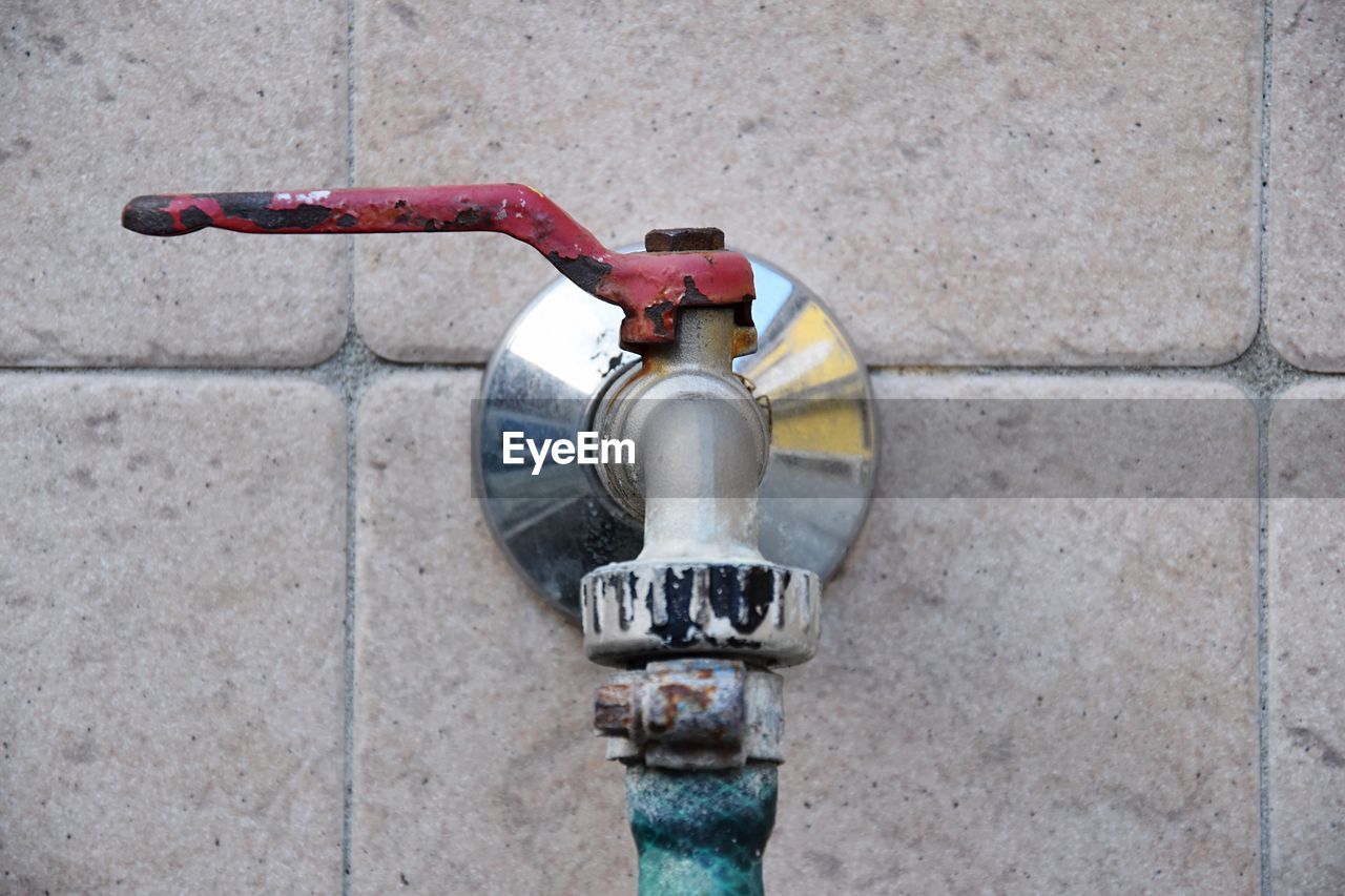 Close-up of faucet on wall