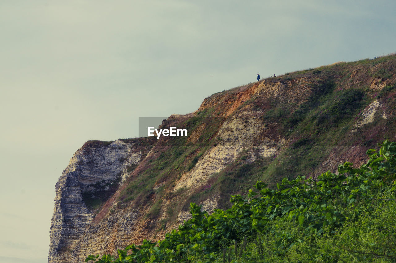 Low angle view of rock formations against sky