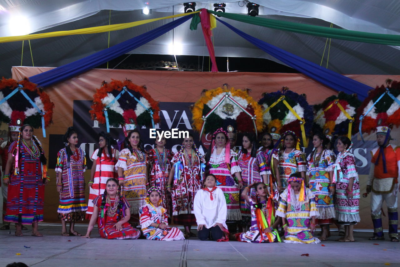 GROUP OF PEOPLE IN TRADITIONAL CLOTHING