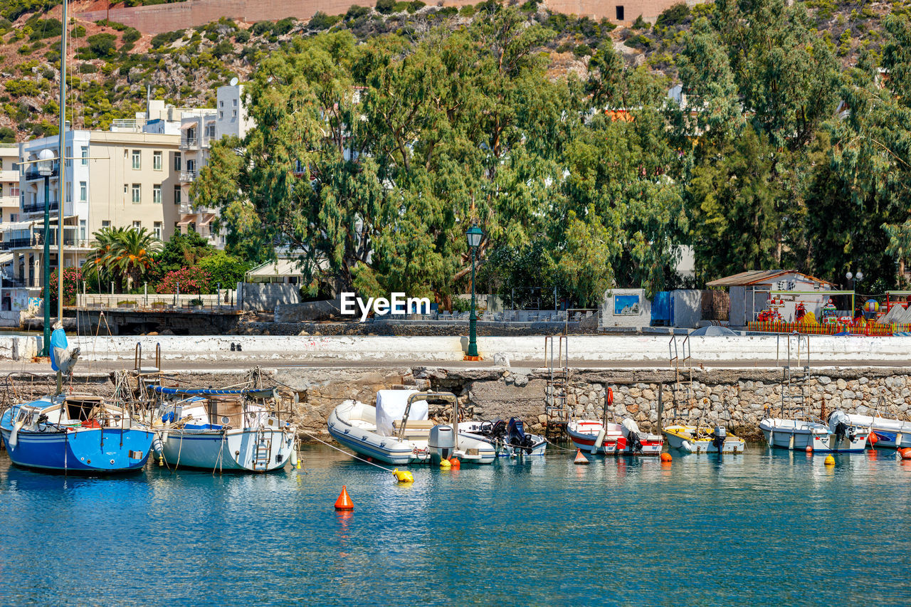 The picturesque promenade of loutraki bay, greece, where old fishing schooners,boats and boats moor