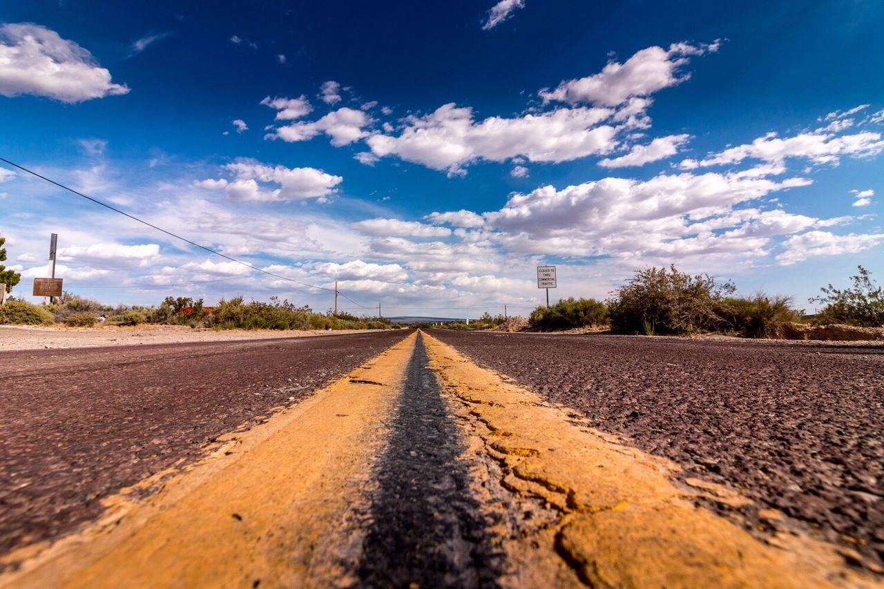 Empty road along landscape