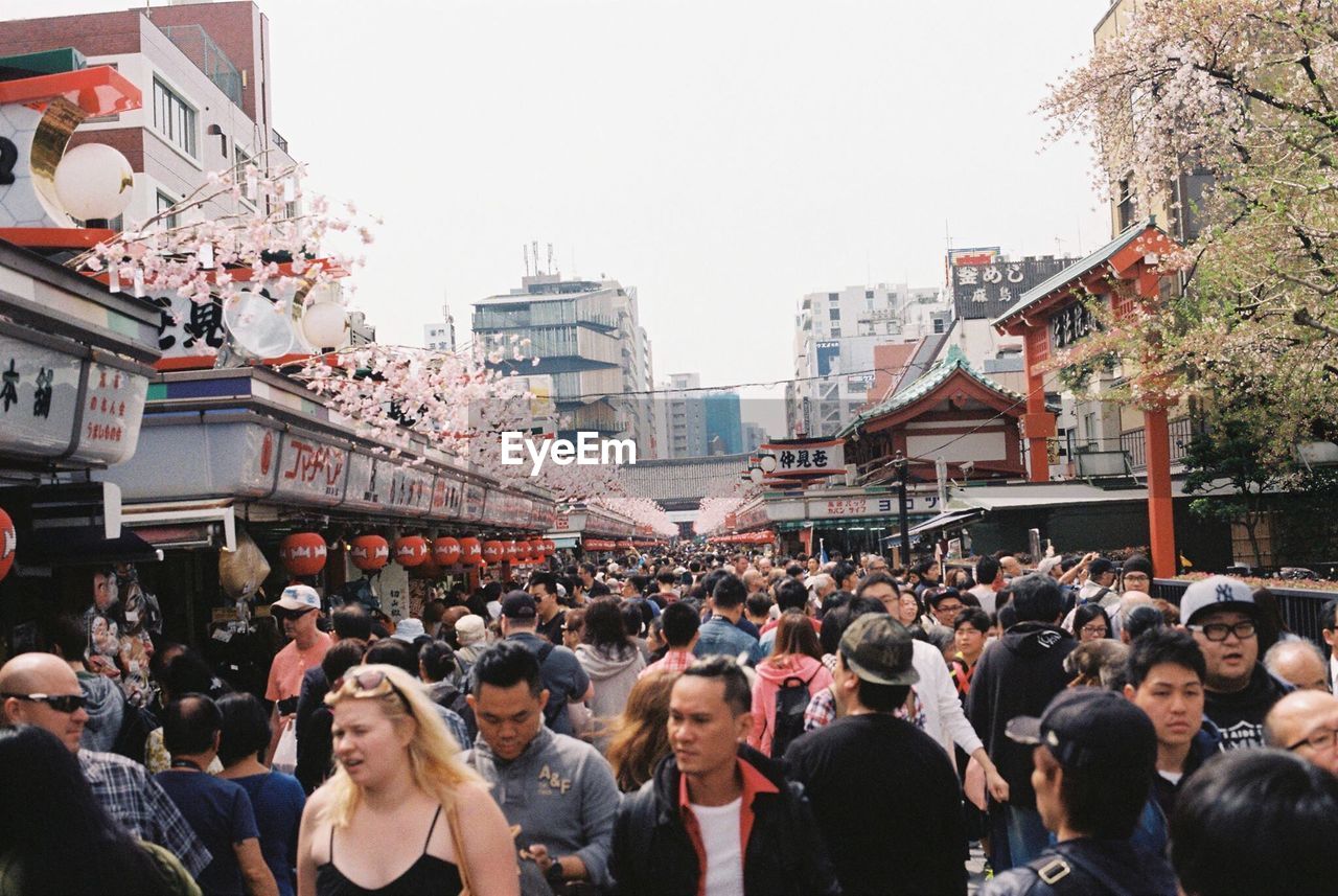 Crowd on street in city