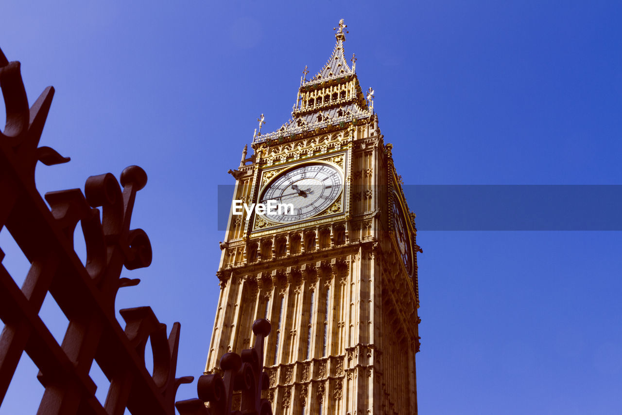 Low angle view of big ben against clear blue sky