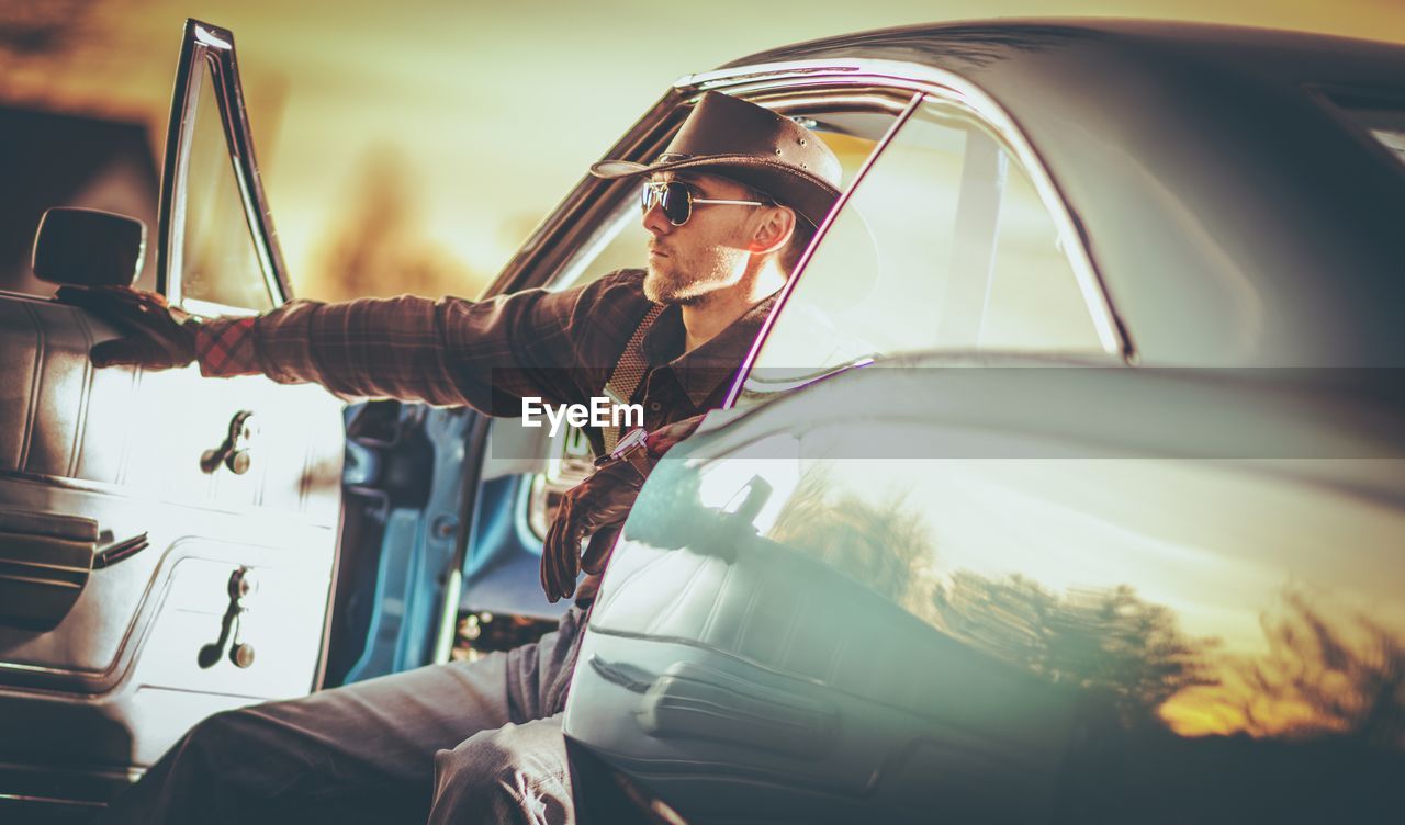 Man sitting in car