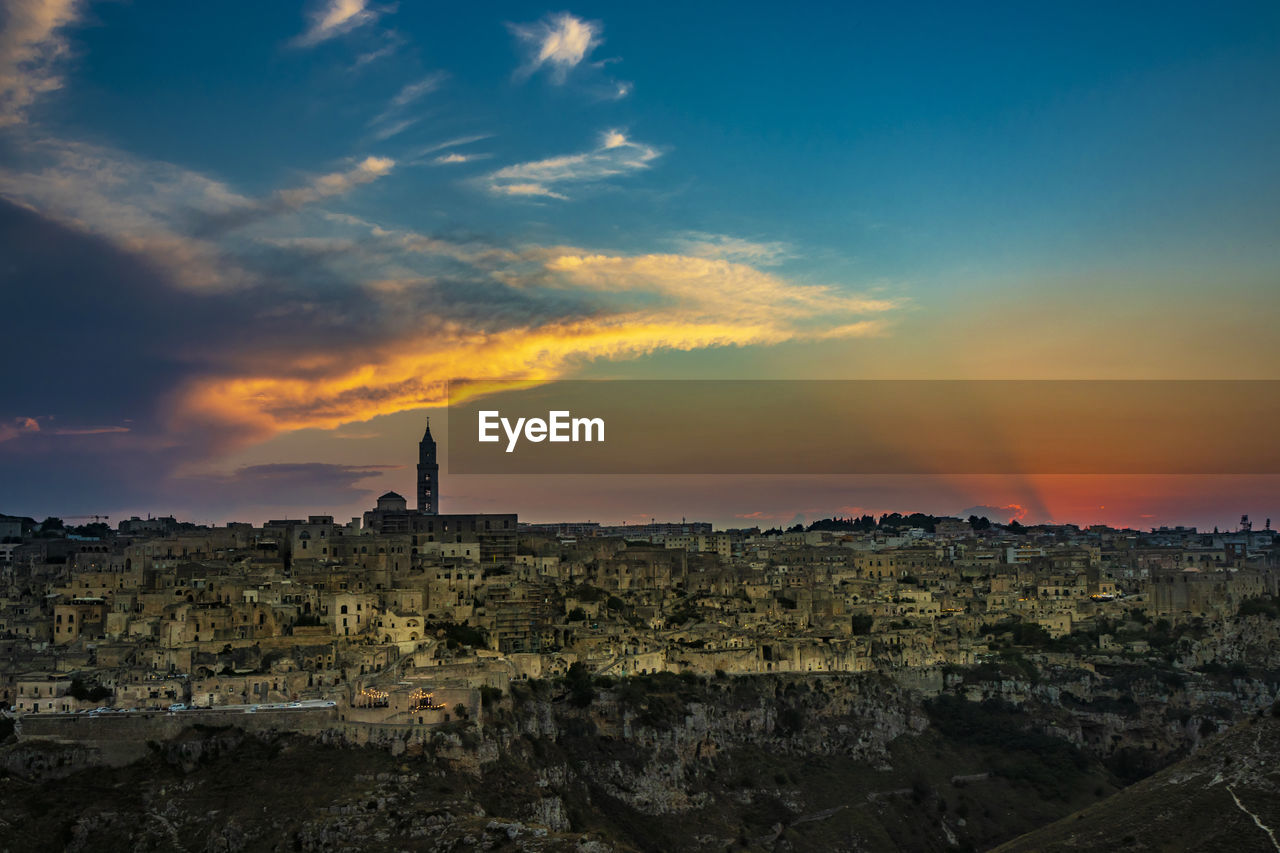 TOWNSCAPE AGAINST SKY DURING SUNSET