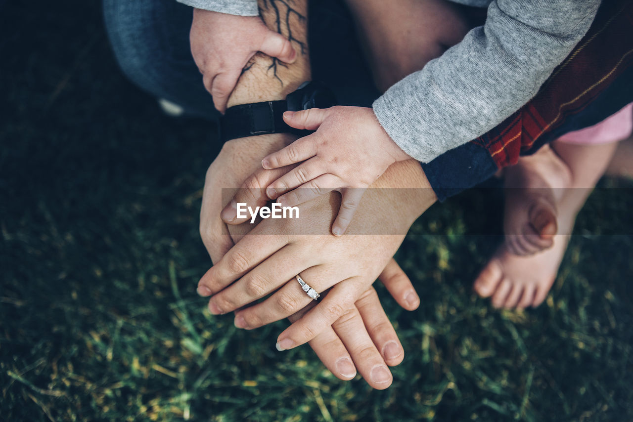 CLOSE-UP OF HANDS FRIENDS