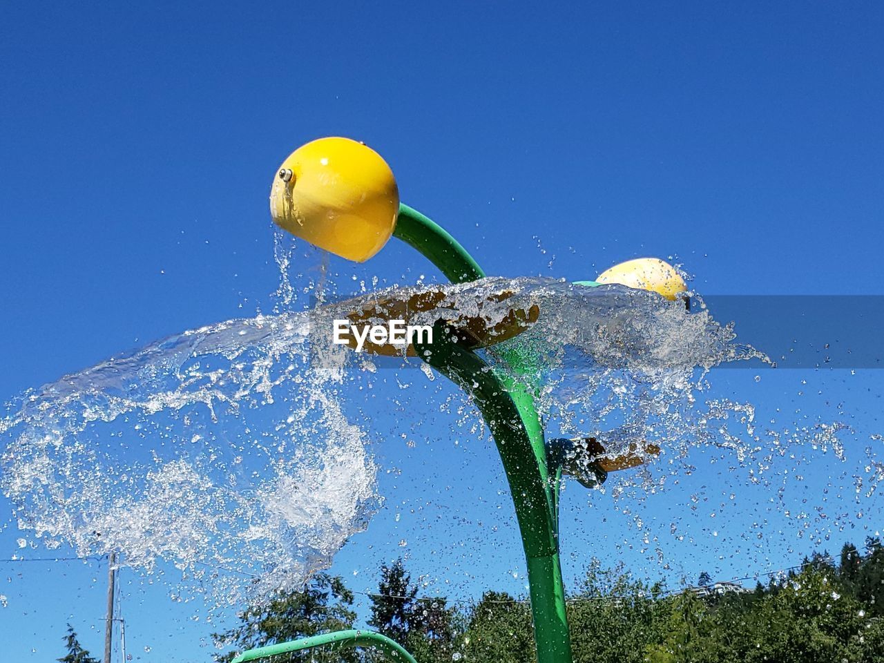 LOW ANGLE VIEW OF YELLOW BALLOON AGAINST BLUE SKY