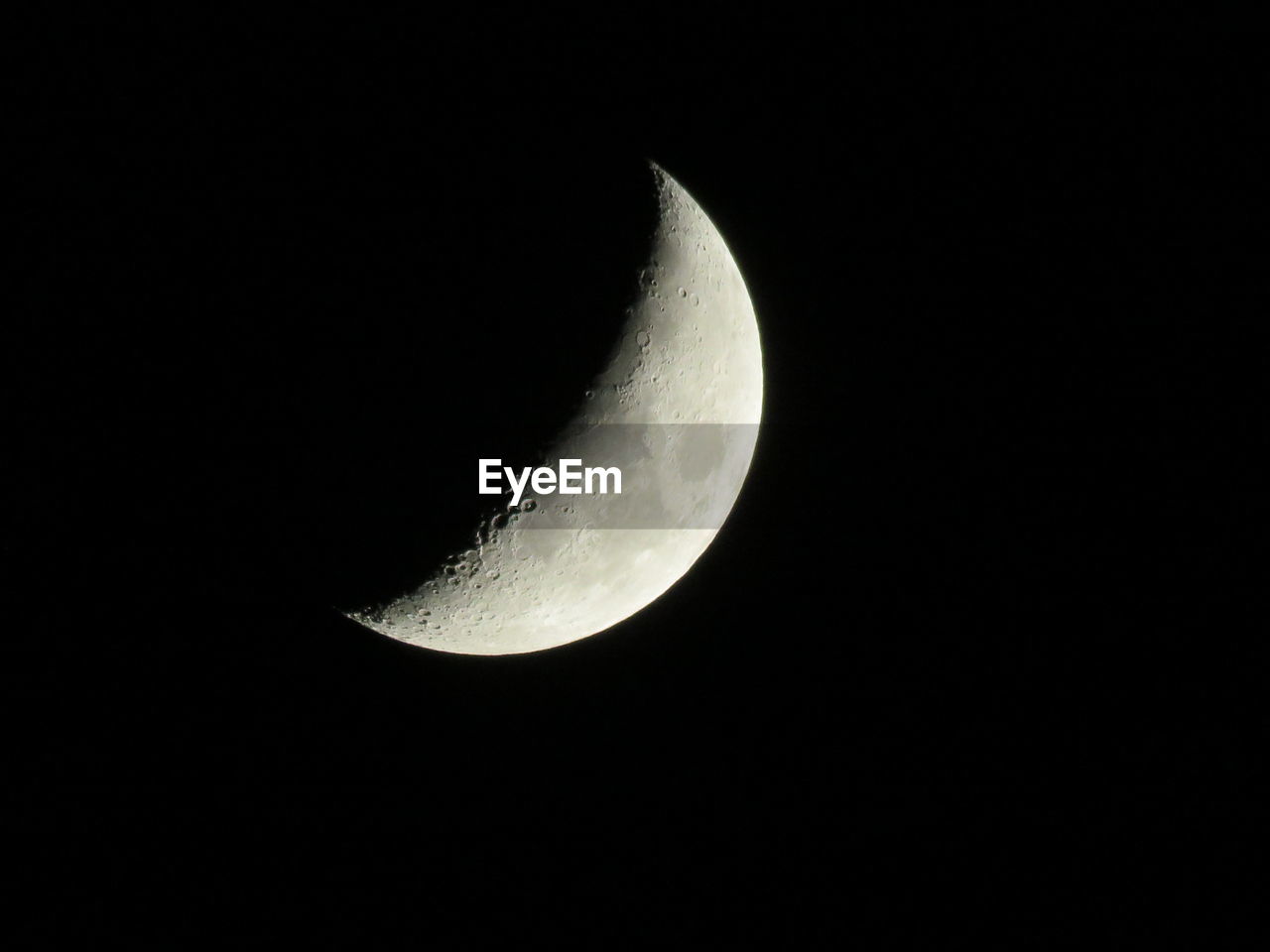 Low angle view of crescent moon against sky at night